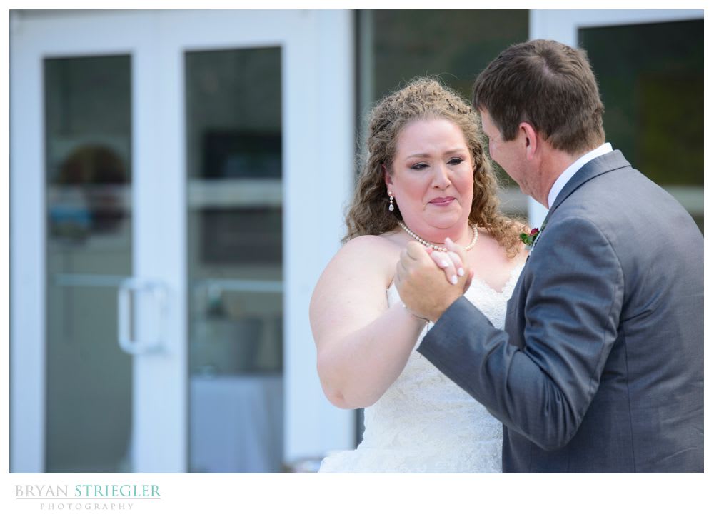 bride crying during father daughter dance